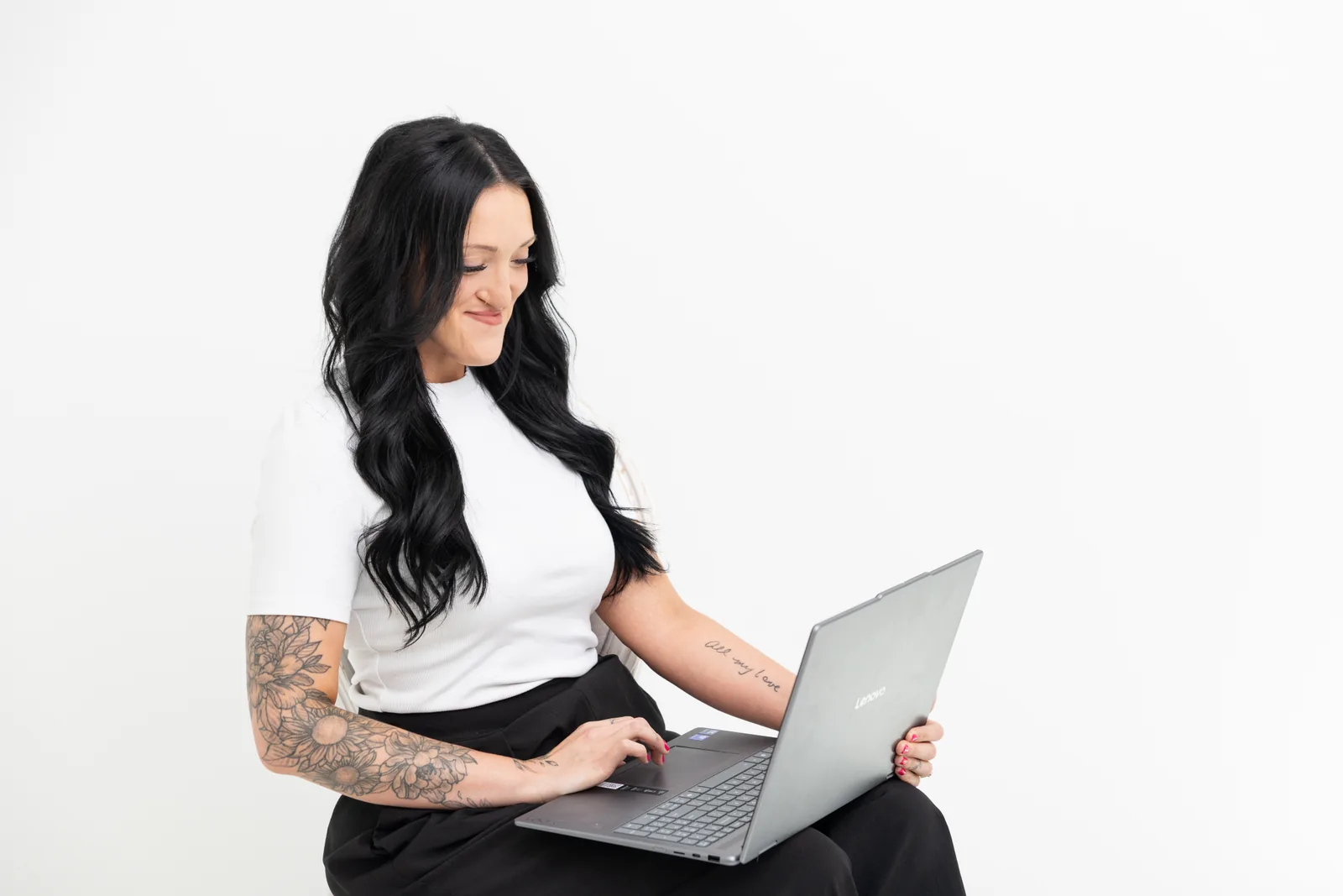 Tysen Creager, founder of Elevate Growth Solutions, working at her laptop